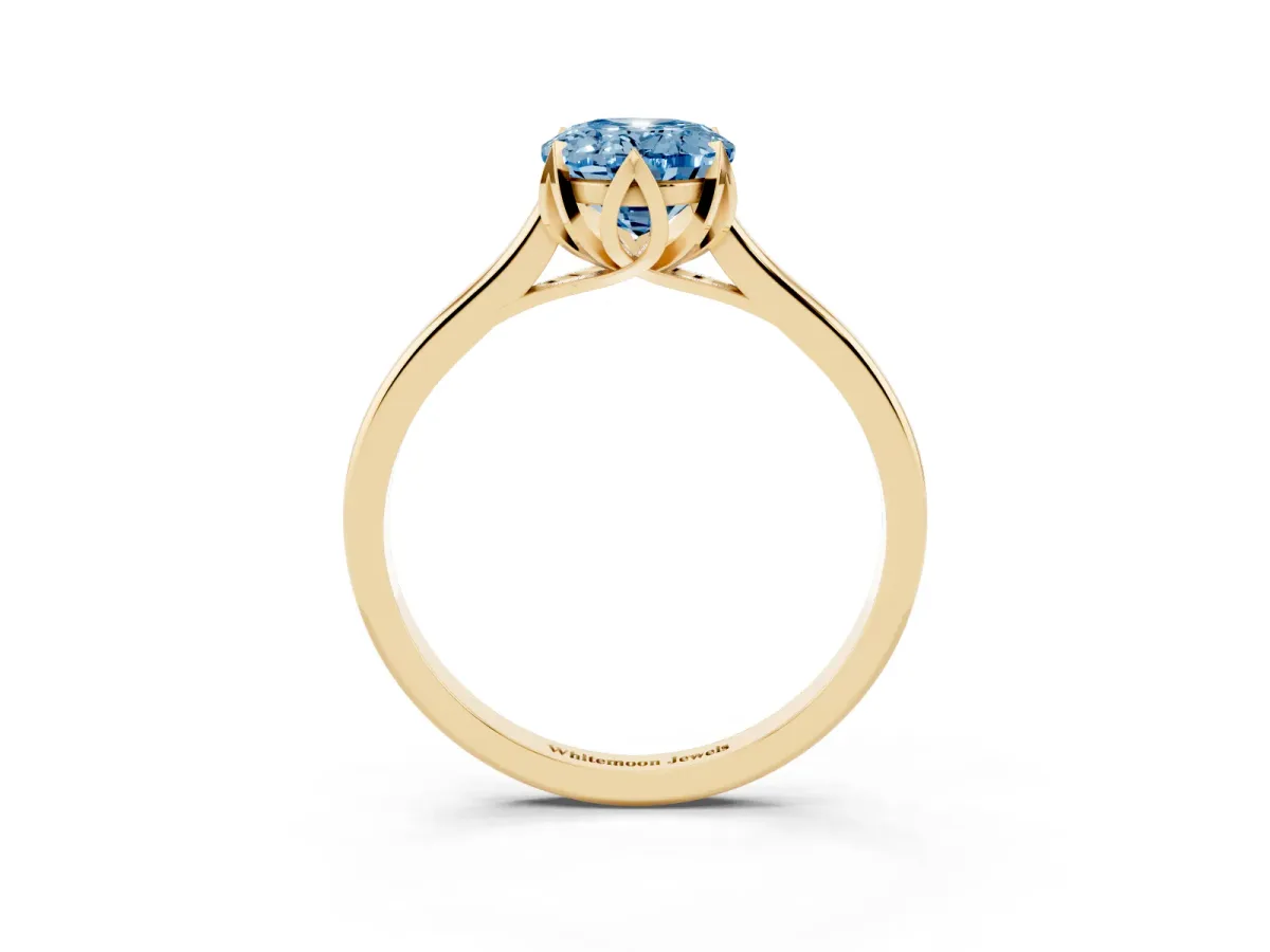 Fancy Blue Oval Cut Diamond Solitaire Ring with Flower Prong Setting and Classic Band Yellow gold