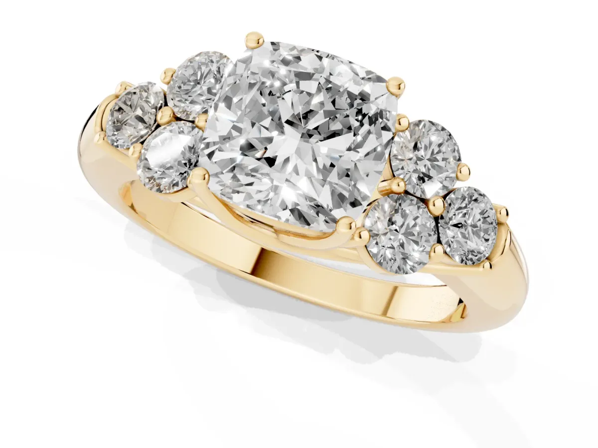 Cushion Cut Cut Diamond Cluster Ring with Round Accent Stones and Prong Setting on a Classic Band Yellow gold
