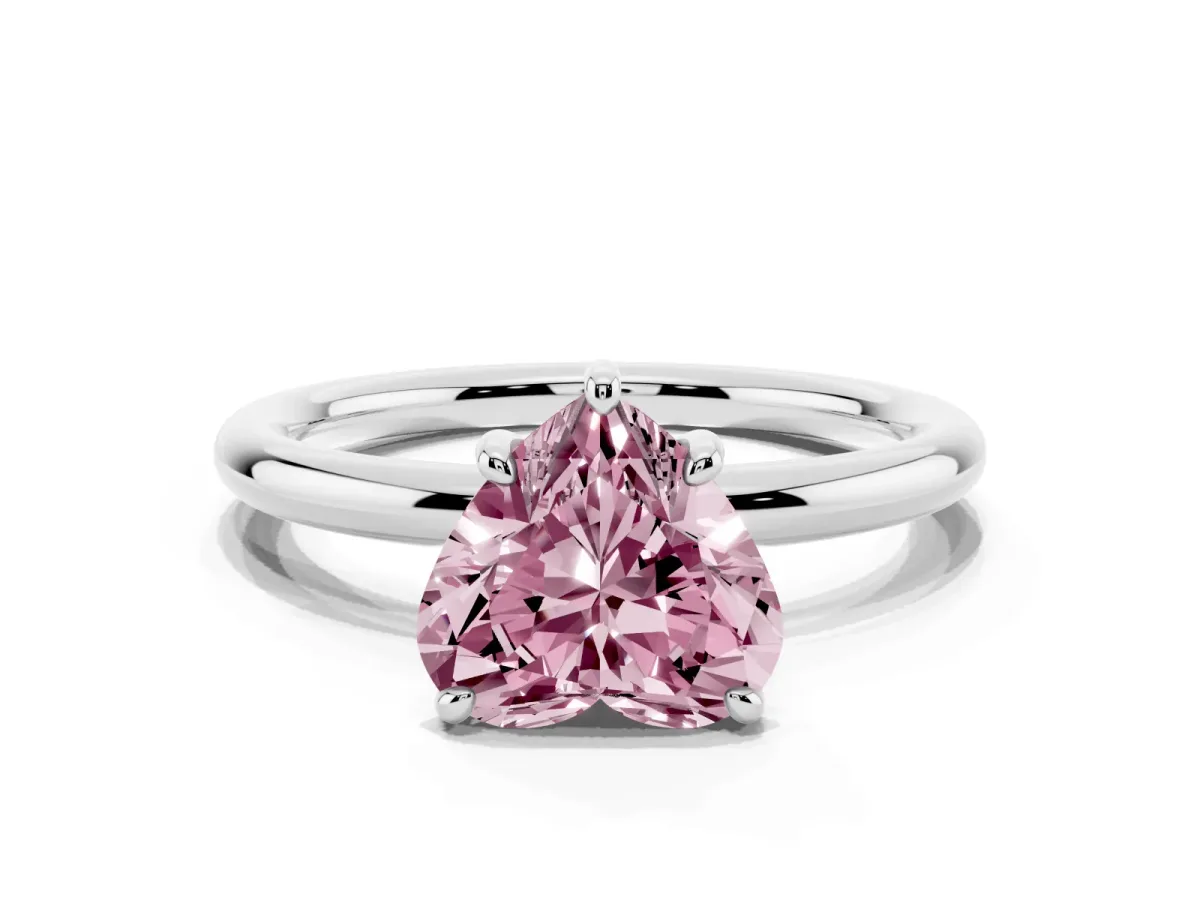 Fancy Pink Heart Cut Solitaire Diamond Ring with Four-Prong Setting on a Plain Band Platinum