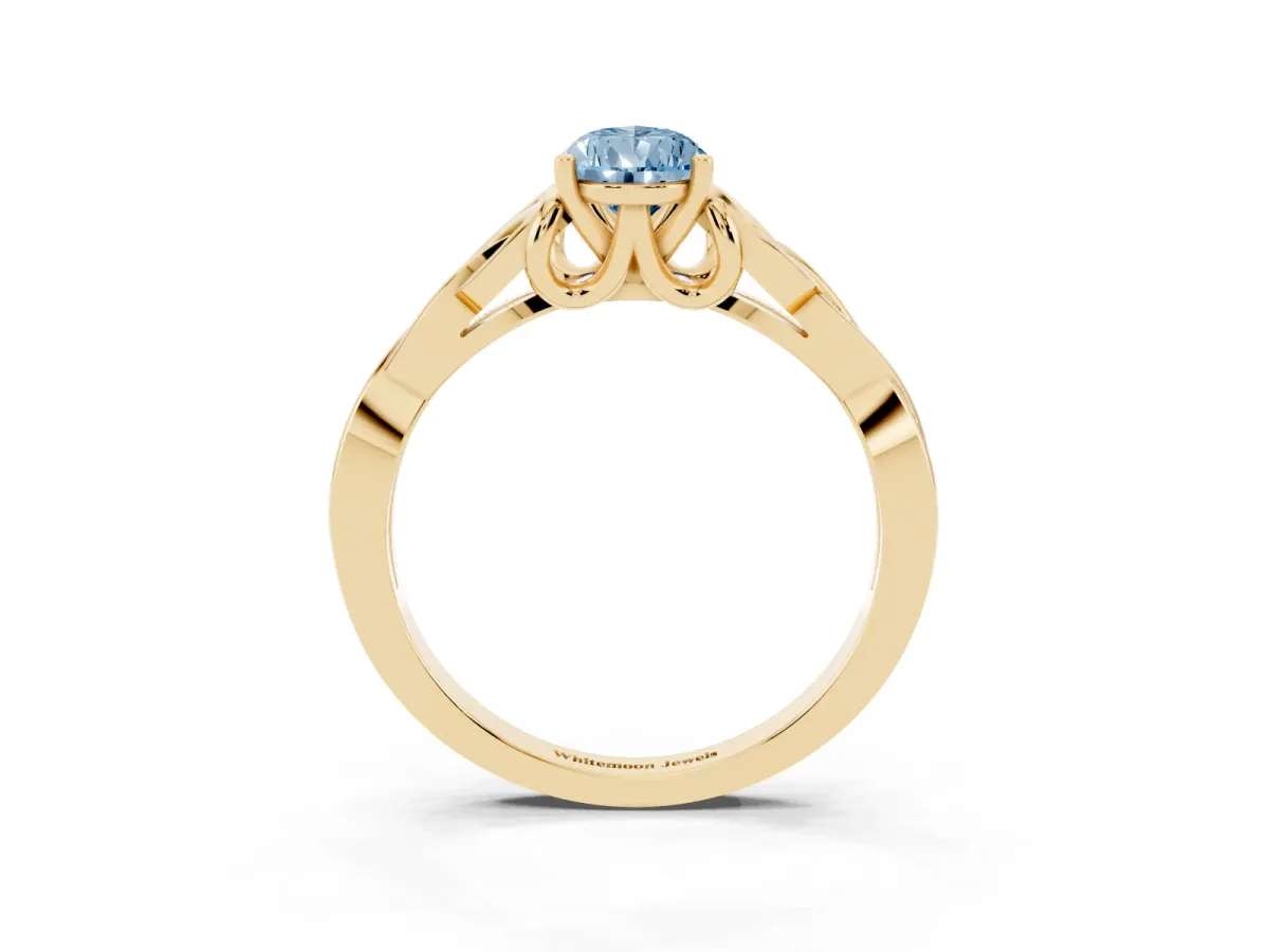 Fancy Blue Pear Cut Diamond Solitaire Engagement Ring with Celtic Knot Band and Four-Prong Setting Yellow gold