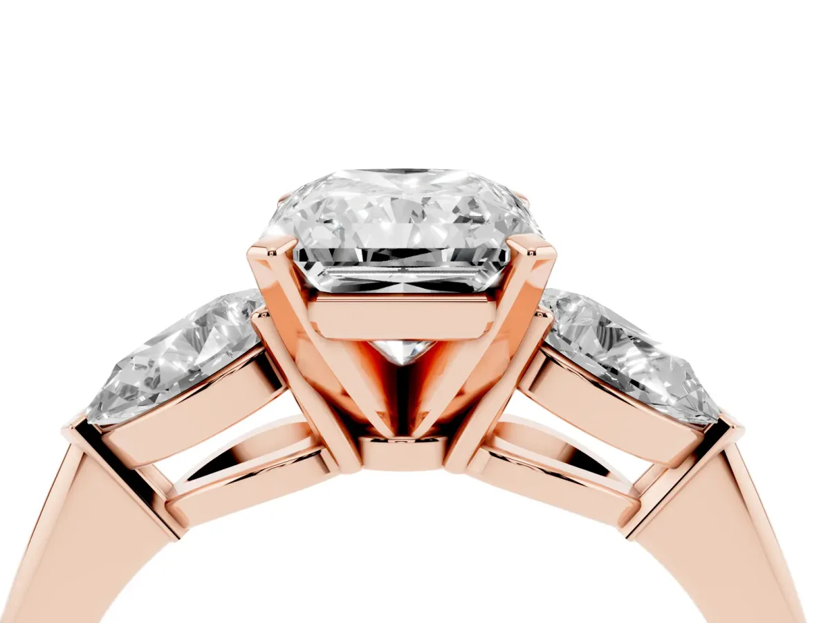 Three-Stone Radiant Cut Diamond Ring with Pear Side Stones and Four-Prong Setting Rose gold