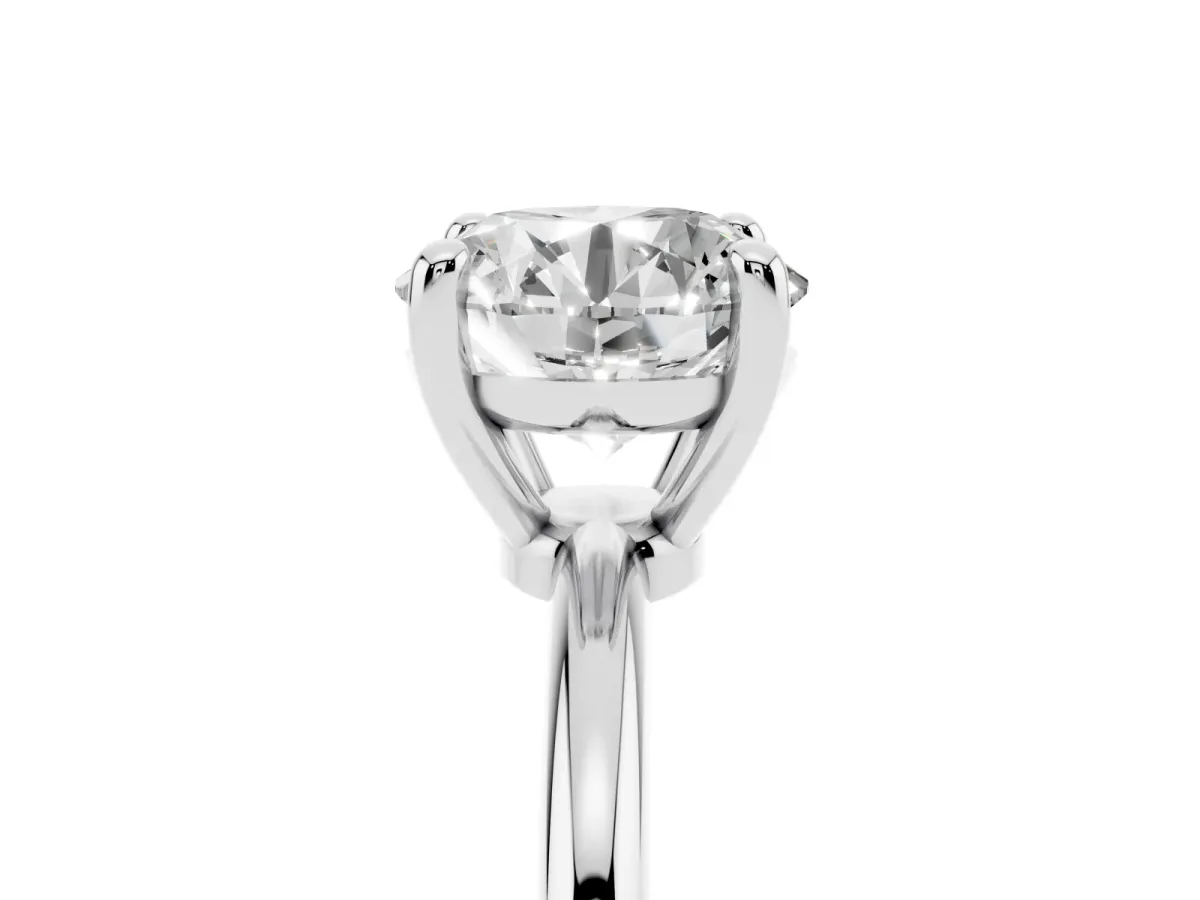 Round Cut Solitaire Diamond Ring with 4-Prong Setting on a Classic Band Platinum