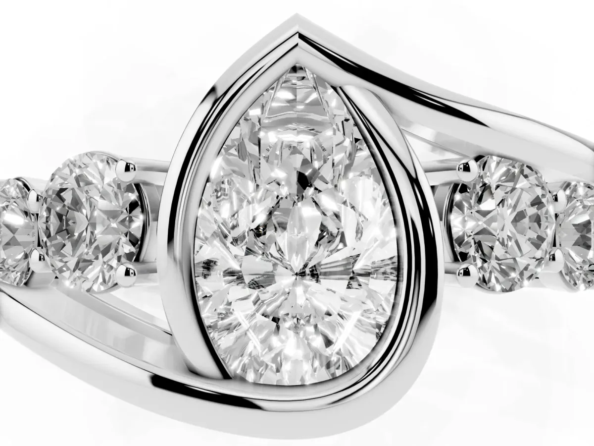 Bezel Set Pear Cut Diamond Bypass Ring with Round Accents Silver