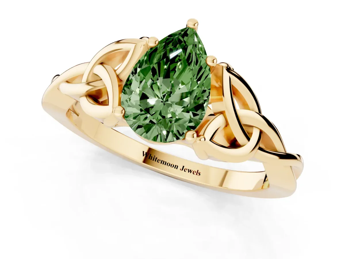 Fancy Green Pear Cut Diamond Solitaire Engagement Ring with Celtic Knot Band and Four-Prong Setting Yellow gold