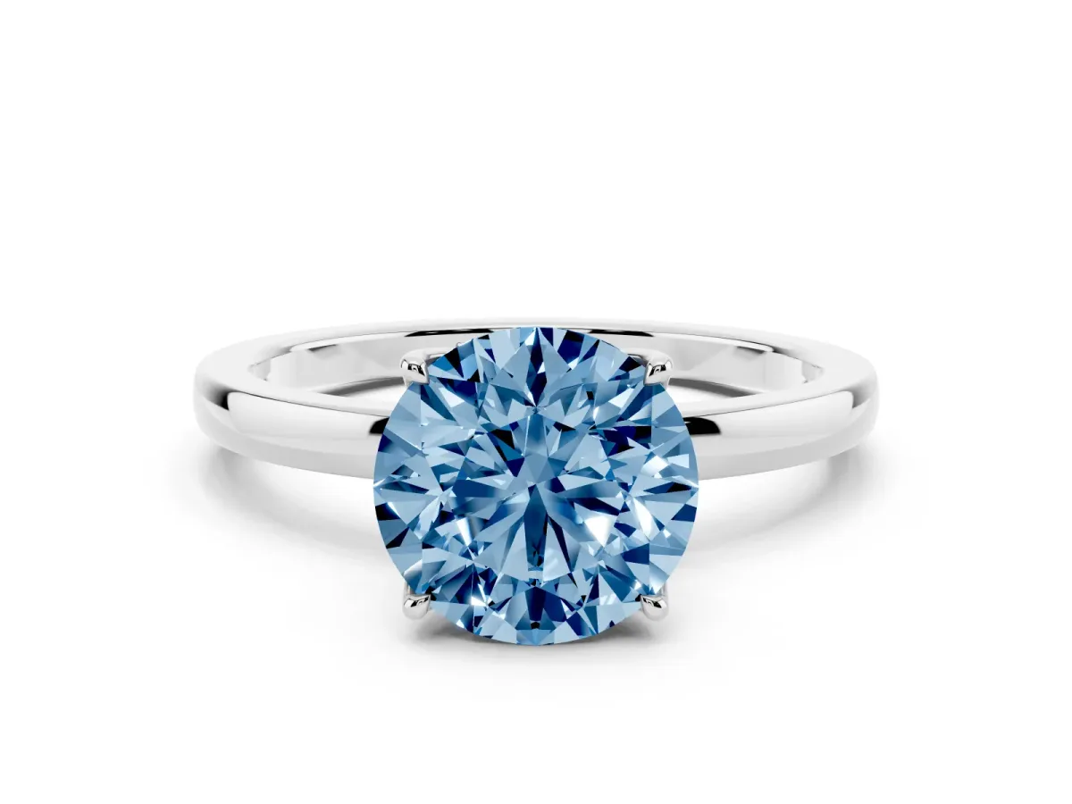 Fancy Blue Round Cut Diamond Solitaire Ring with Thin Band and Prong Setting Silver