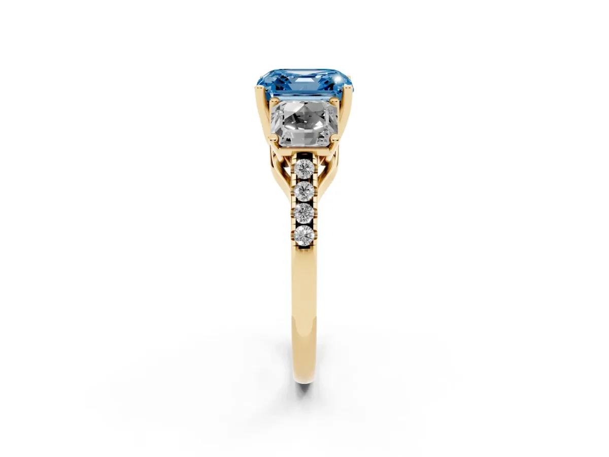 Fancy Blue Three-Stone Asscher Cut Diamond Ring with Round Pavé Band and Prong Setting Yellow gold