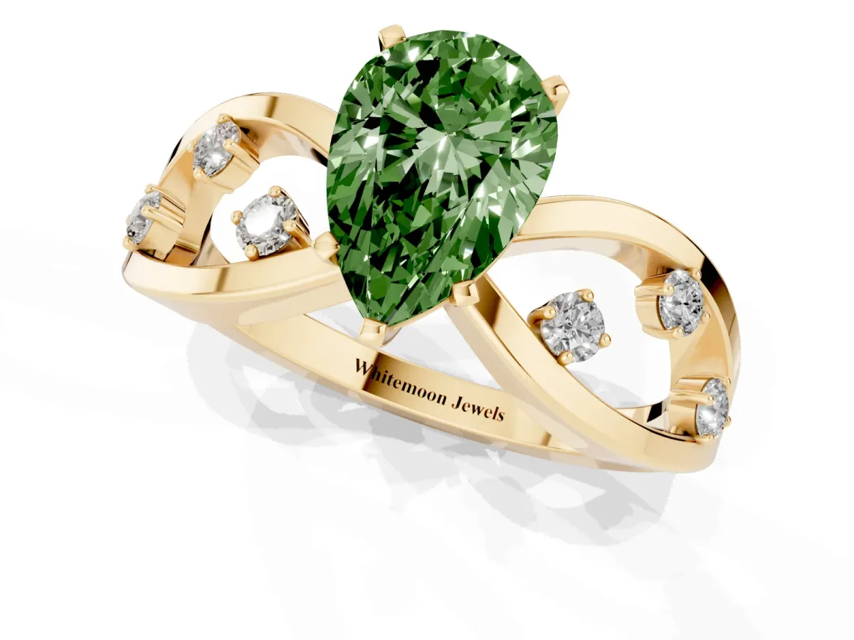 Fancy Green Pear Cut Cut Solitaire Diamond with Side Stones on Criss-Cross Band and Four-Prong Setting Yellow gold