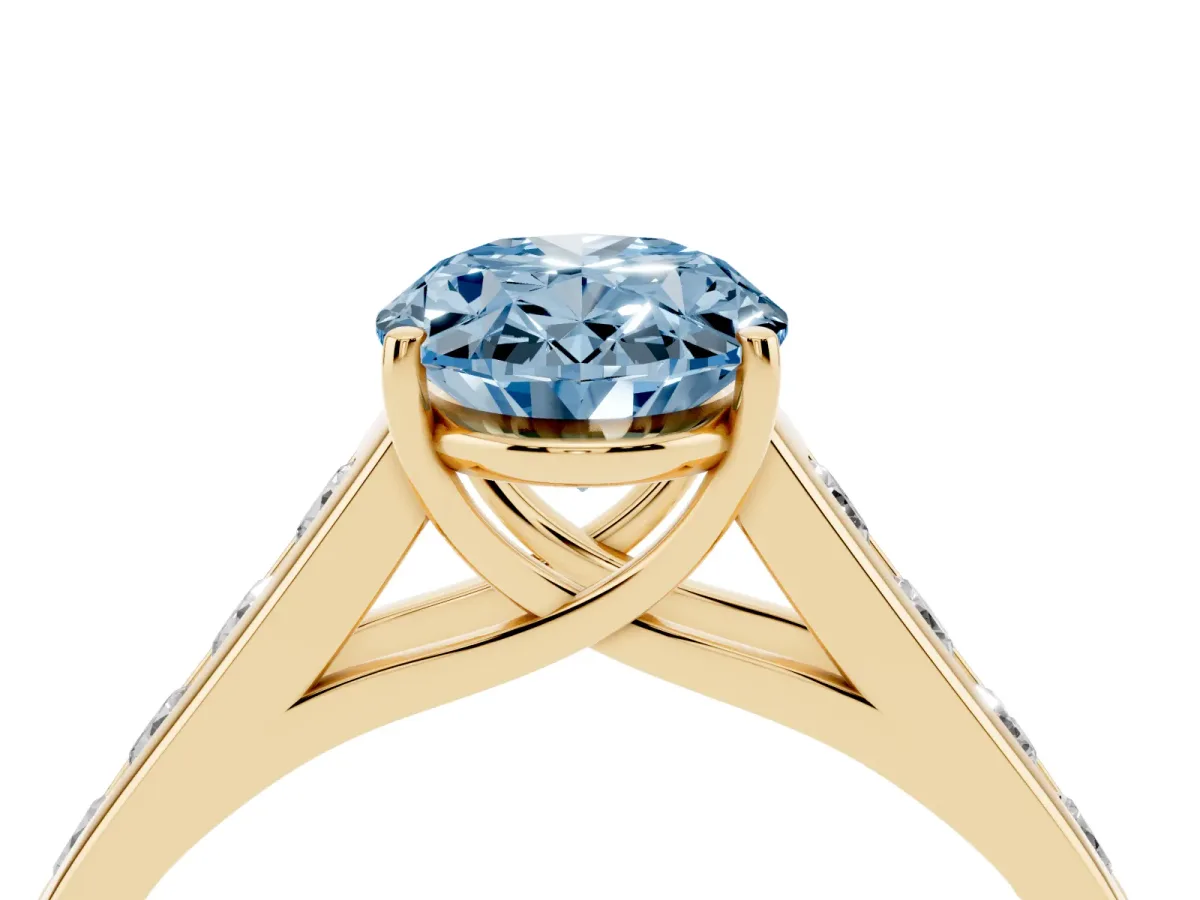 Fancy Blue Oval Cut Solitaire Channel-Set Diamond Engagement Ring with Four-Prong Setting Yellow gold