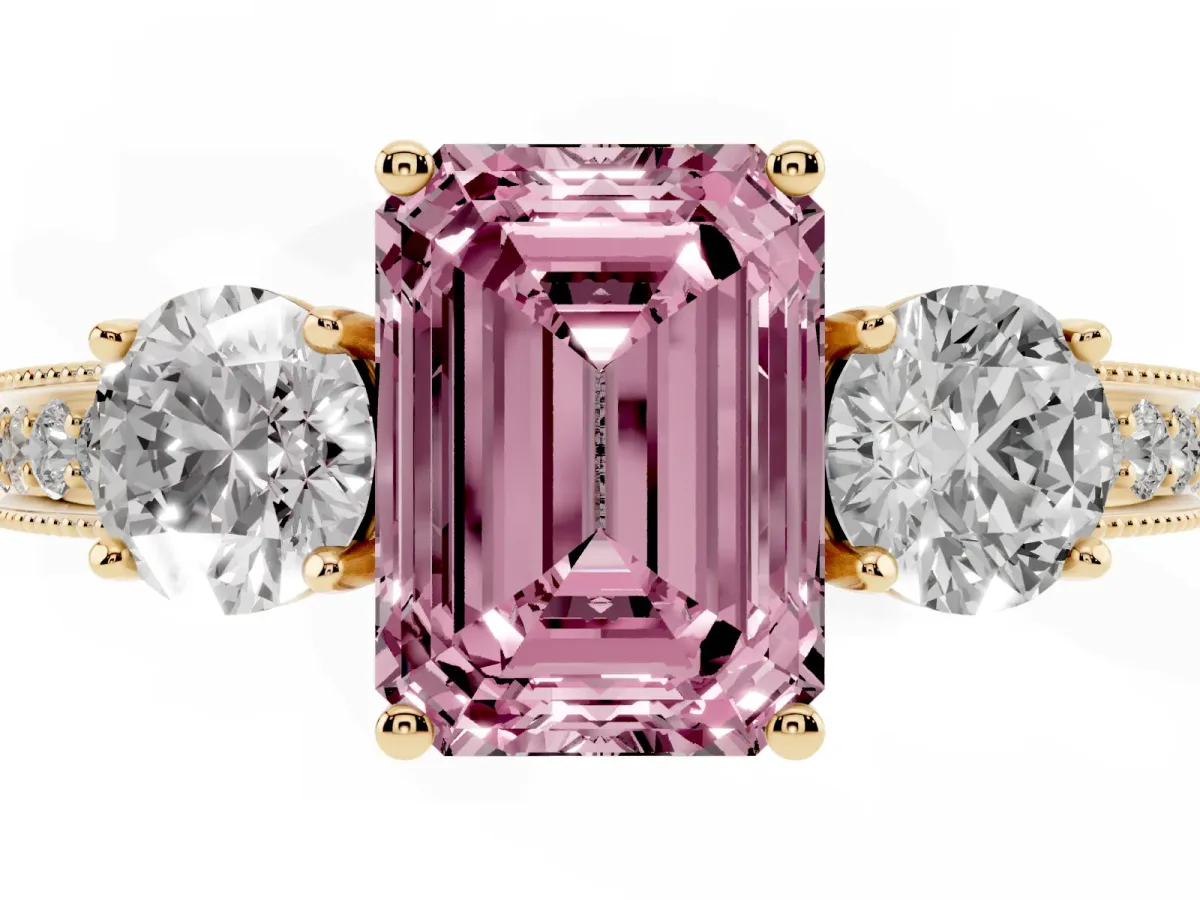 Fancy Pink Emerald Cut Three-Stone Diamond Ring with Pavé Band and Four-Prong Setting Yellow gold