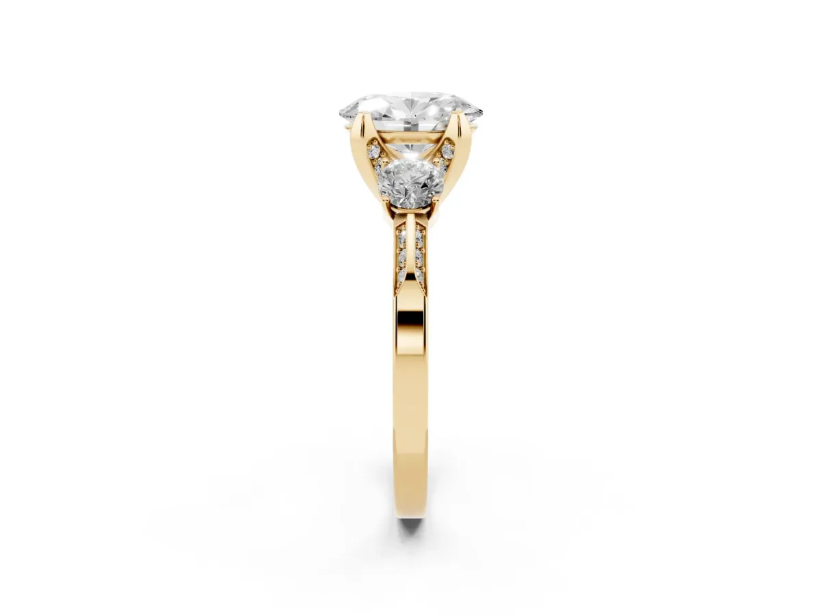 Oval Cut Brilliant Three-Stone Diamond Ring with Pavé Band and Four-Prong Setting Yellow gold