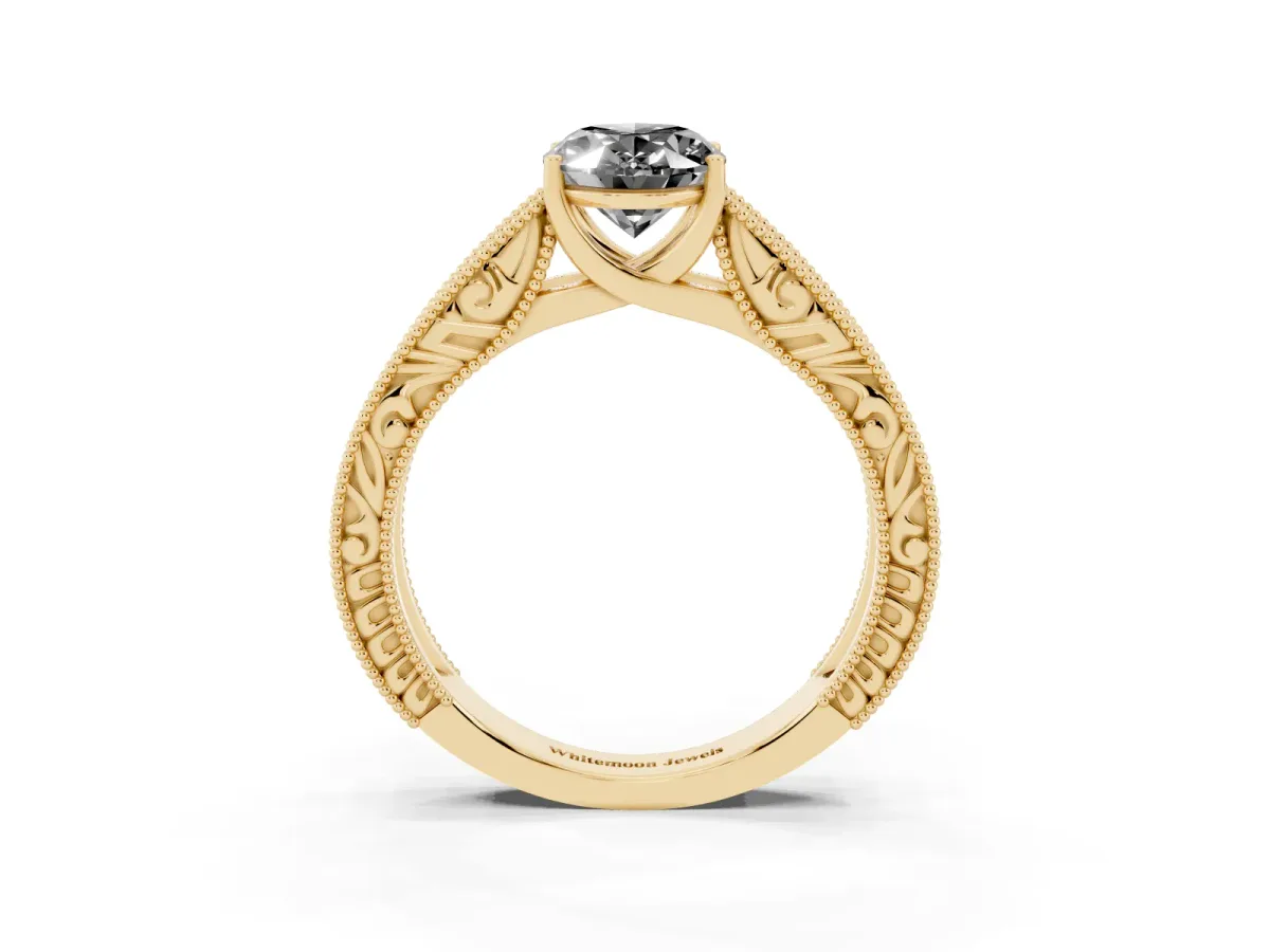 Fancy Black Oval Cut Diamond Solitaire Ring with Engraved Band and Four-Prong Setting Yellow gold