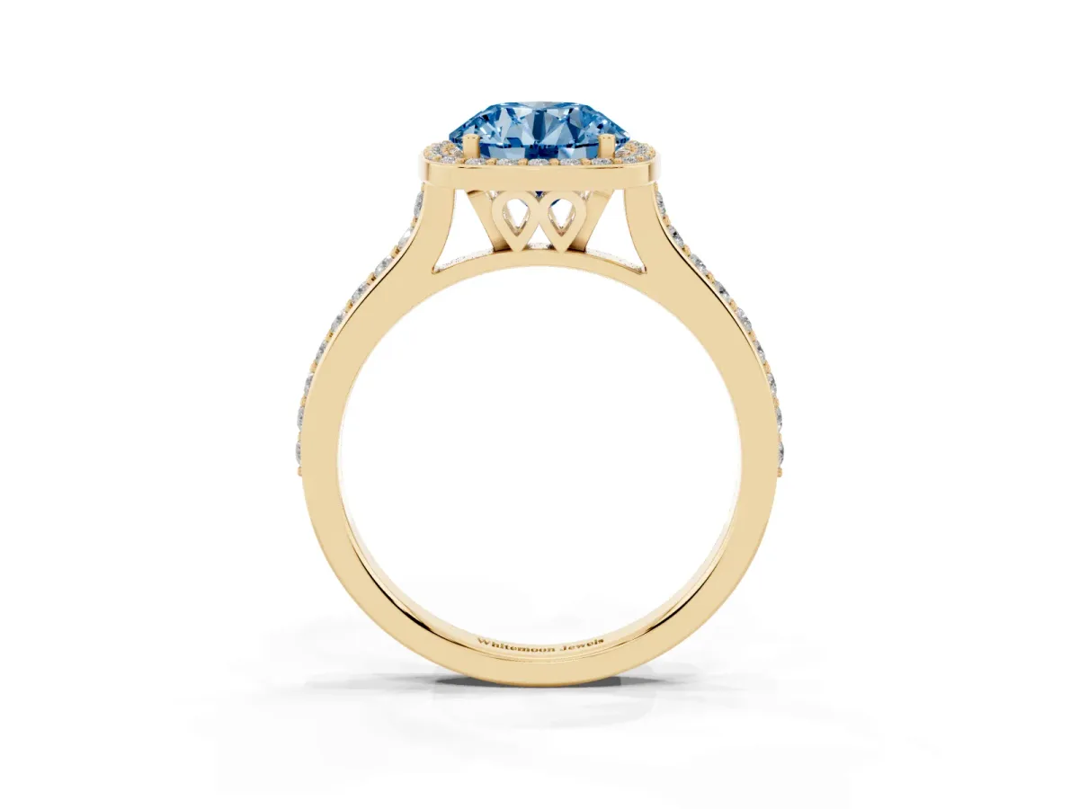 Fancy Blue Round Cut Diamond Halo Engagement Ring with Round Pavé Shoulders and Prong Setting Yellow gold