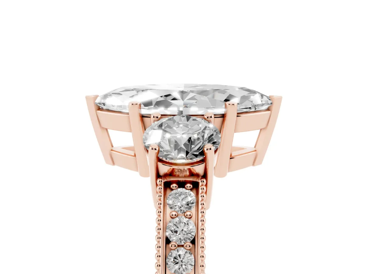 Marquise Cut Three-Stone Diamond Ring with Pavé Band and Four-Prong Setting Rose gold