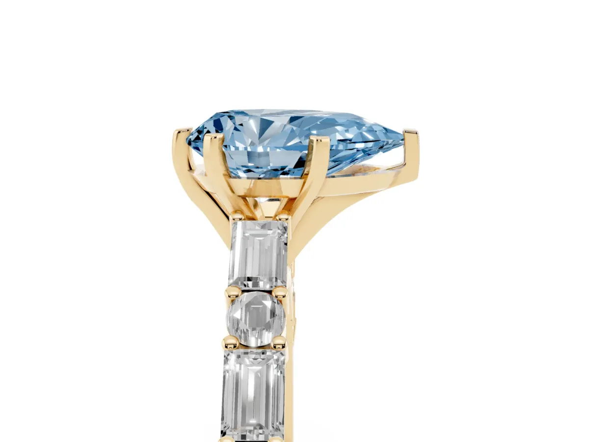 Fancy Blue Pear Cut Diamond Solitaire with Side Baguettes and Channel Set Band Yellow gold