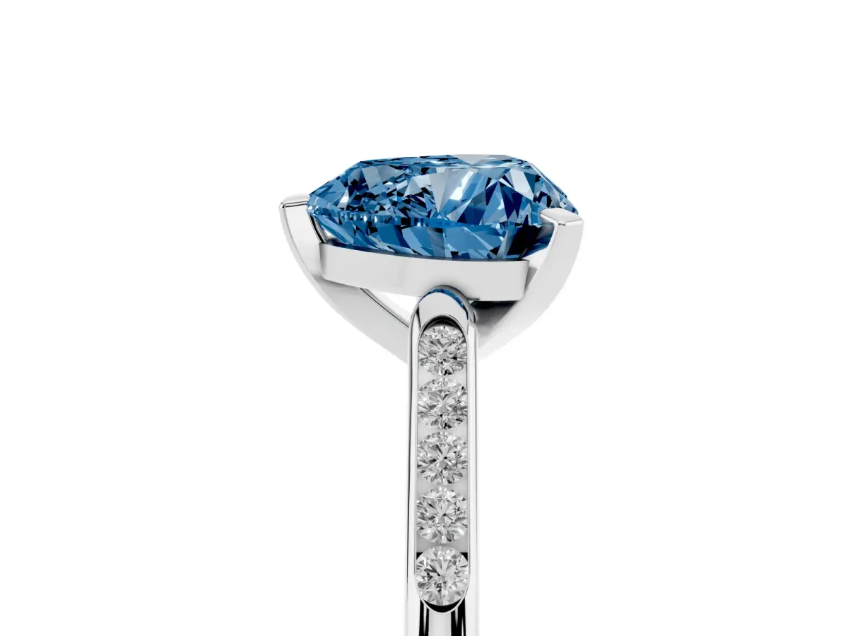 Fancy Blue Heart Cut Diamond Solitaire Ring with Channel Set Round Band and Prong Setting Silver