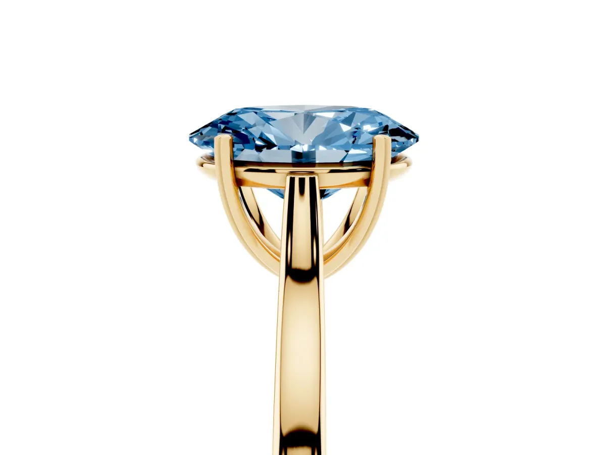 Fancy Blue Oval Cut Solitaire Heart Prong Engagement Ring with Tapered Band Yellow gold