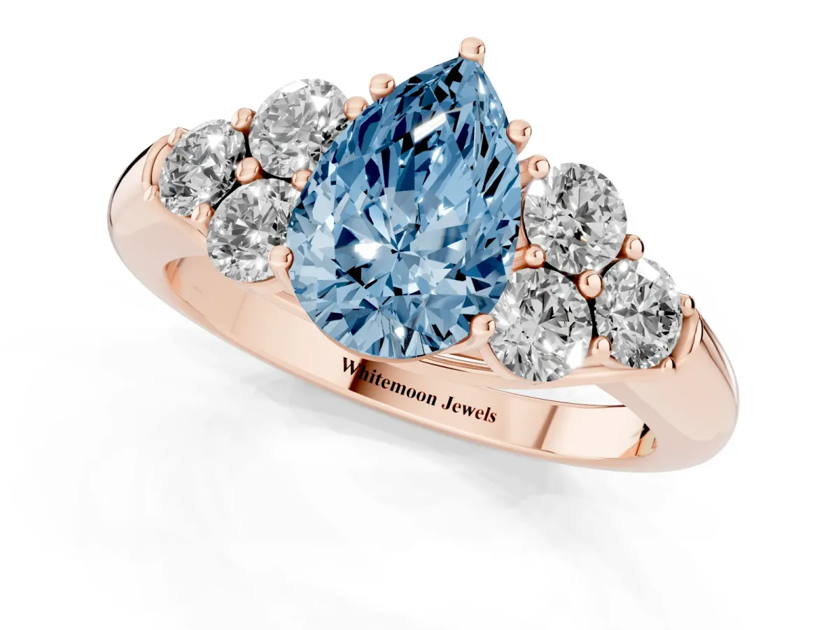 Fancy Blue Pear Cut Cut Diamond Cluster Ring with Round Accent Stones and Prong Setting on a Classic Band Rose gold