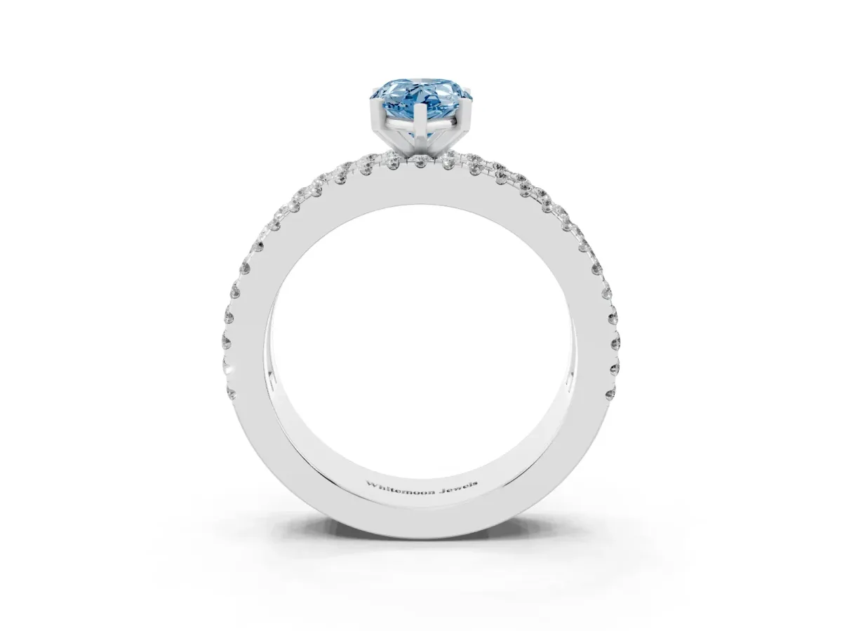 Fancy Blue Pear Cut Diamond Solitaire Ring with Pavé and Channel Set Band Silver