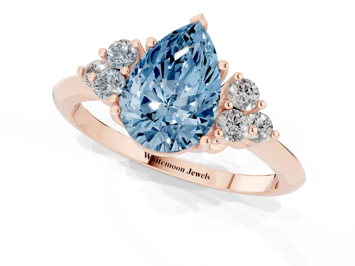 Fancy Blue Pear Cut Cut Diamond Cluster Ring with Solitaire Band and Four-Prong Setting Rose gold
