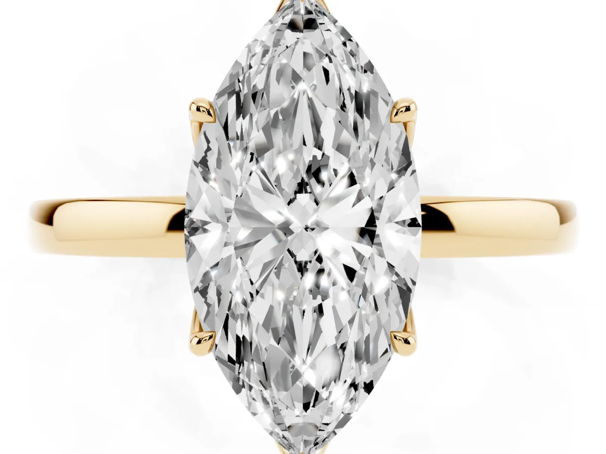 Marquise Cut Diamond Solitaire Ring with Thin Band and Prong Setting Yellow gold