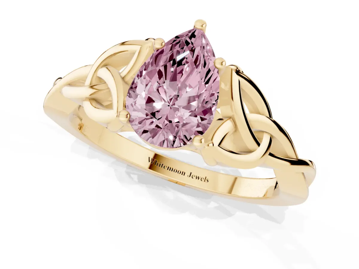 Fancy Pink Pear Cut Diamond Solitaire Engagement Ring with Celtic Knot Band and Four-Prong Setting Yellow gold