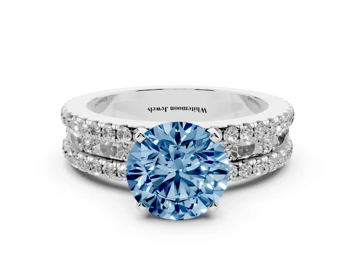 Fancy Blue Round Cut Diamond Solitaire Ring with Pavé and Channel Set Band Platinum