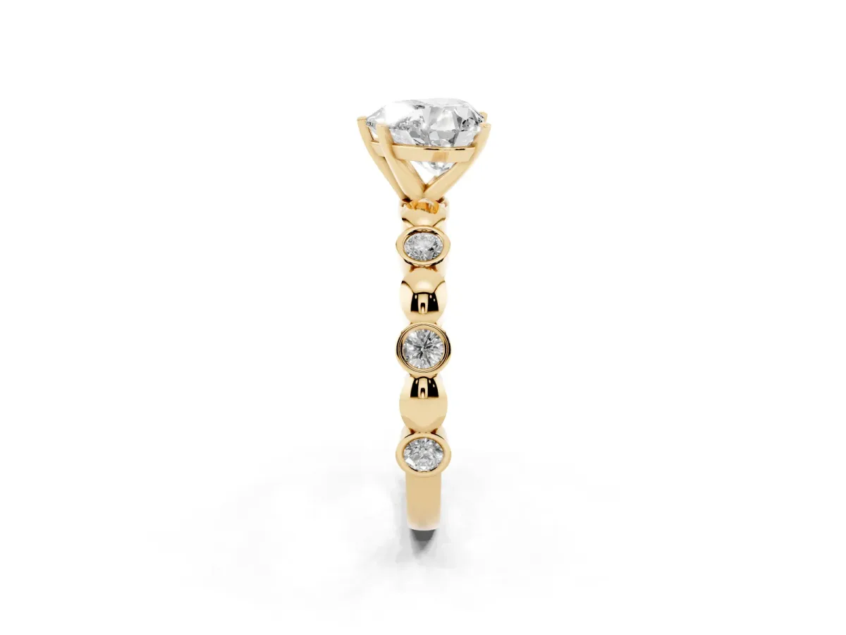 Heart Cut Solitaire Bezel-Set Diamond Ring with Beaded Band and Four-Prong Setting Yellow gold