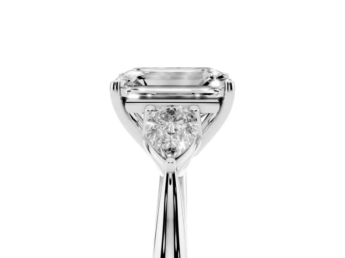 Three-Stone Emerald Cut Brilliant Diamond Solitaire Ring with Tapered Band and Four-Prong Setting Platinum
