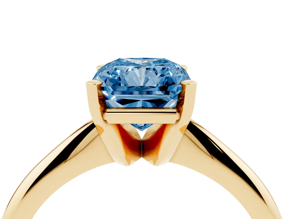 Fancy Blue Radiant Cut Cut Solitaire Ring with Four-Prong Setting on a Classic Band Yellow gold