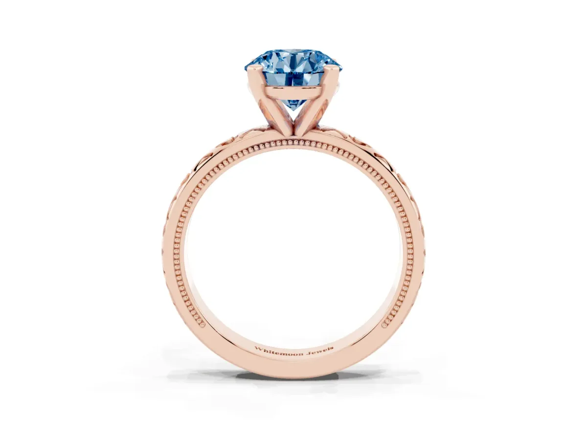 Fancy Blue Round Cut Solitaire Diamond Engagement Ring with XO Engraved Band and Four-Prong Setting Rose gold