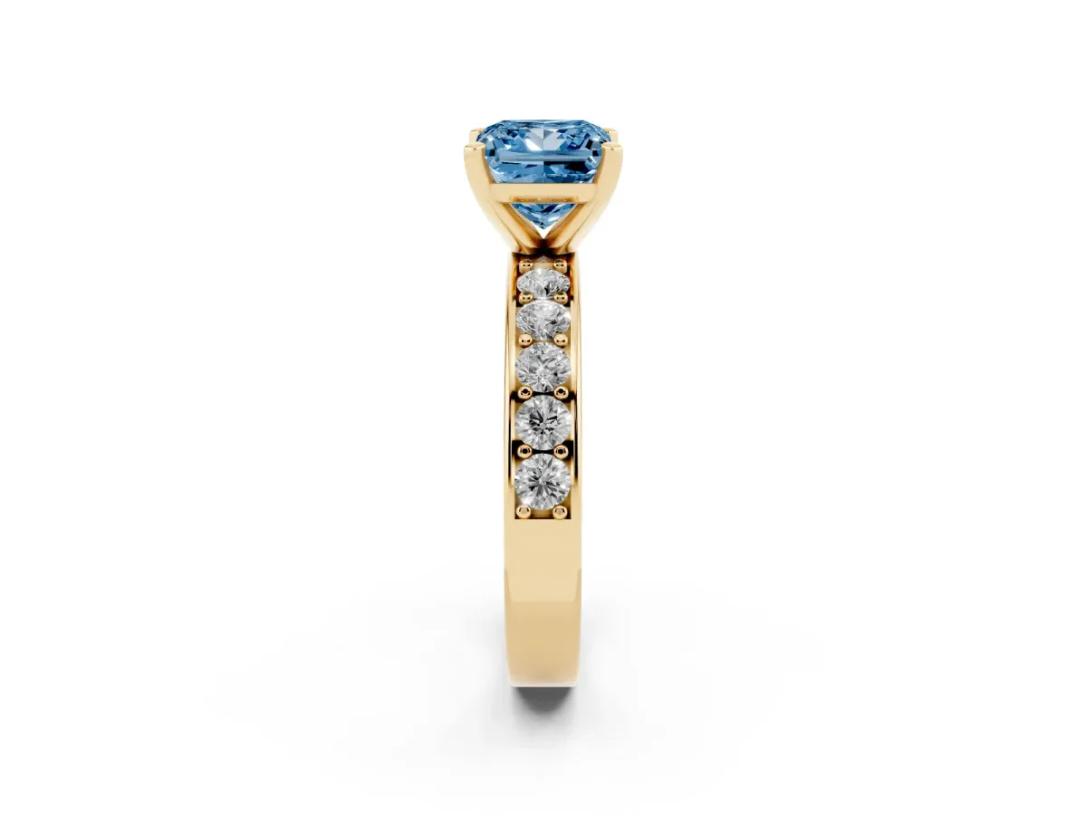 Fancy Blue Princess Cut Diamond Engagement Ring with Channel Set Round Band and Prong Setting Yellow gold