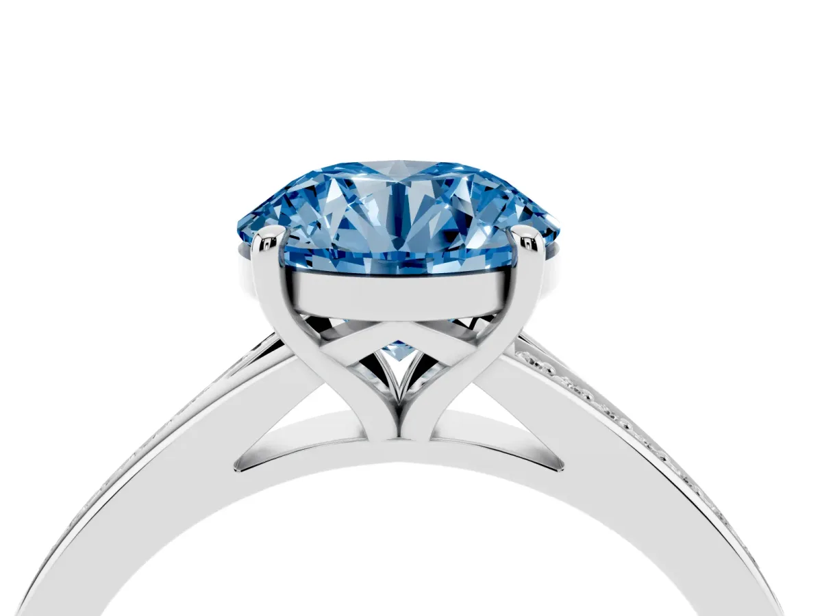Fancy Blue Round Cut Diamond Solitaire Ring with Pavé Band and Prong Setting Silver
