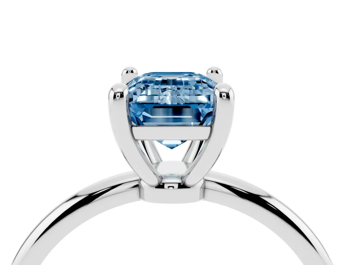Fancy Blue Emerald Cut Solitaire Diamond Ring with 4-Prong Setting on a Classic Band Platinum