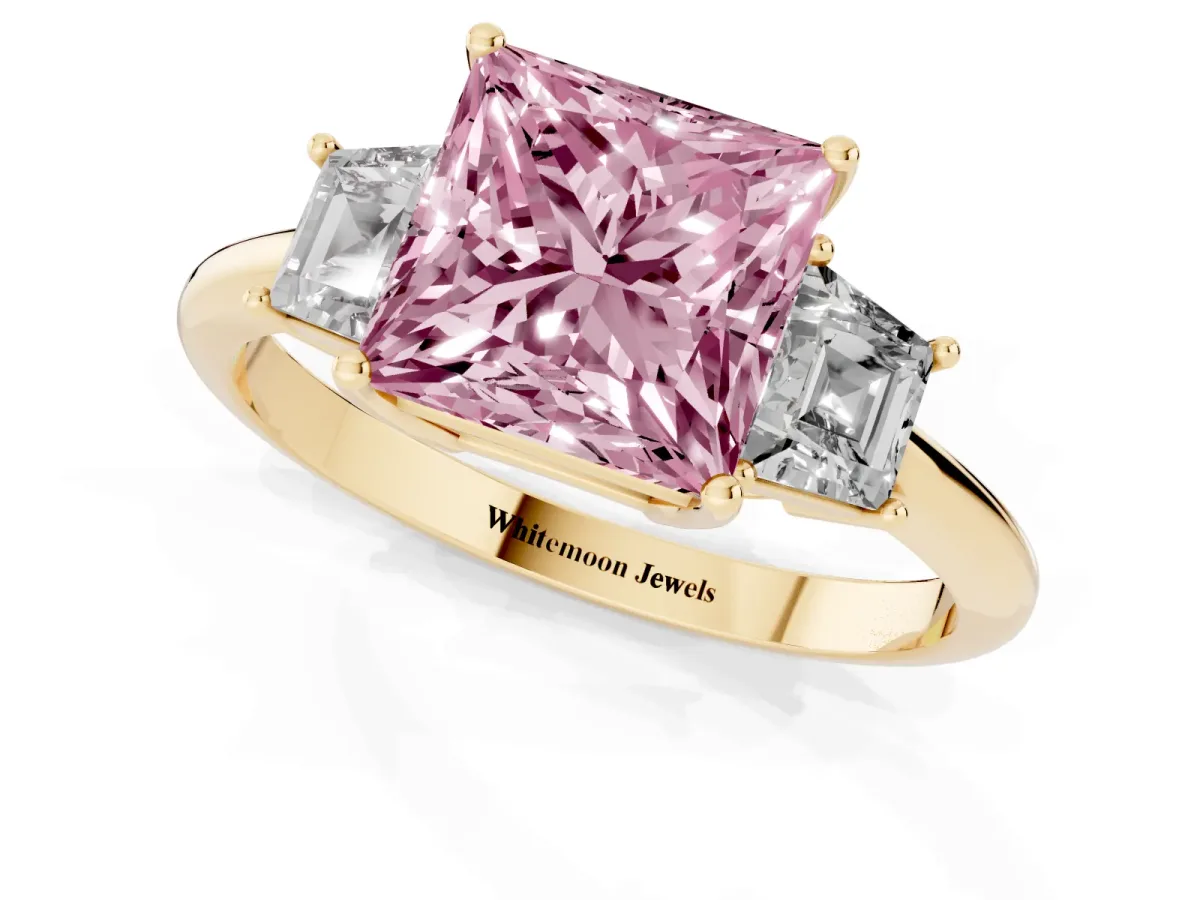 Fancy Pink Princess Cut Diamond Three-Stone Ring with Trapezoid Side Stones and Prong Setting Yellow gold
