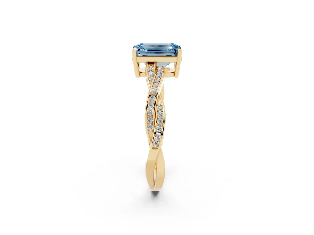 Fancy Blue Emerald Cut Solitaire Twisted Pave Diamond Ring with Four-Prong Setting Yellow gold