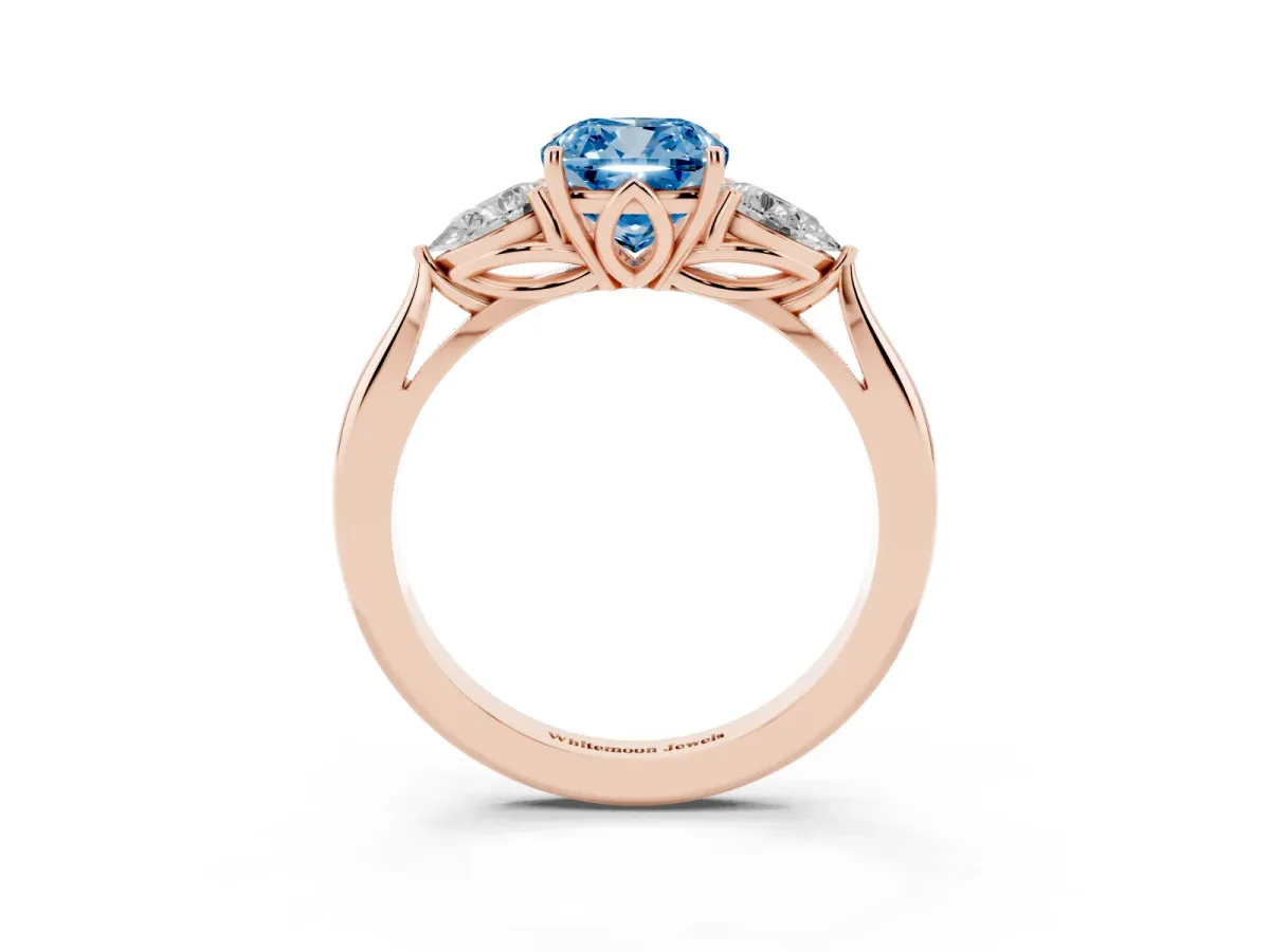 Fancy Blue Three-Stone Cushion Cut Diamond Ring with Pear Side Stones in Four-Prong Setting Rose gold