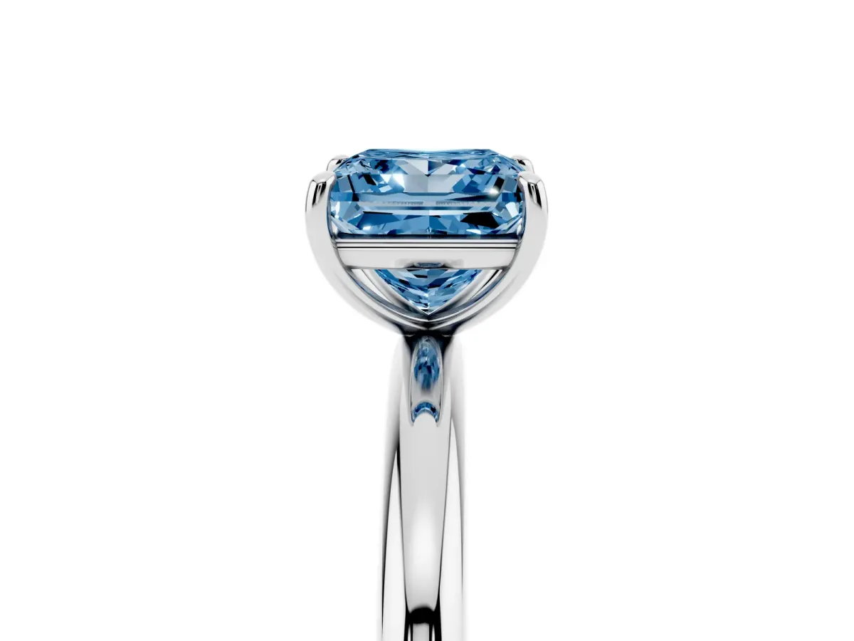 Fancy Blue Princess Cut Solitaire Diamond Ring with Four-Prong Setting on a Plain Band Platinum
