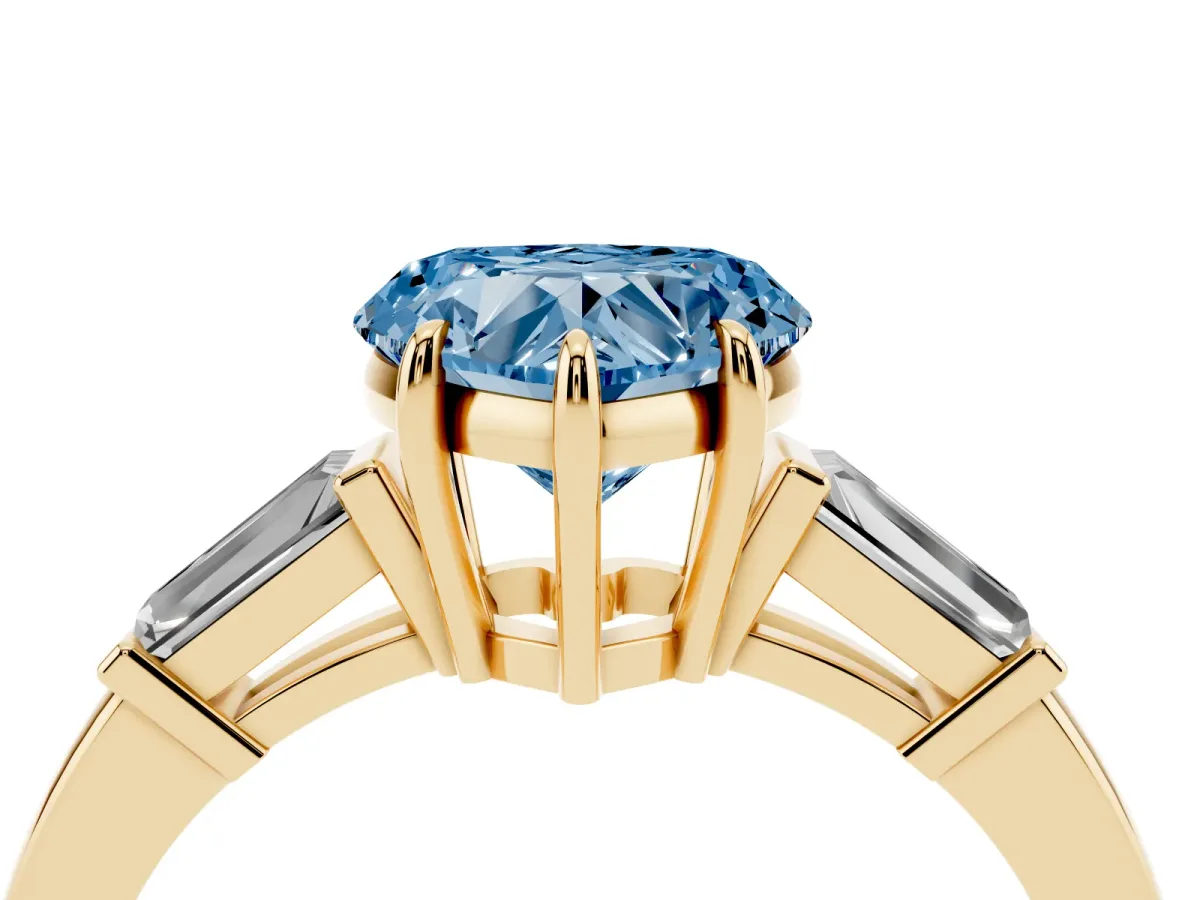 Fancy Blue Heart Cut Diamond Three-Stone Ring with Tapered Baguette Side Stones and Prong Setting Yellow gold