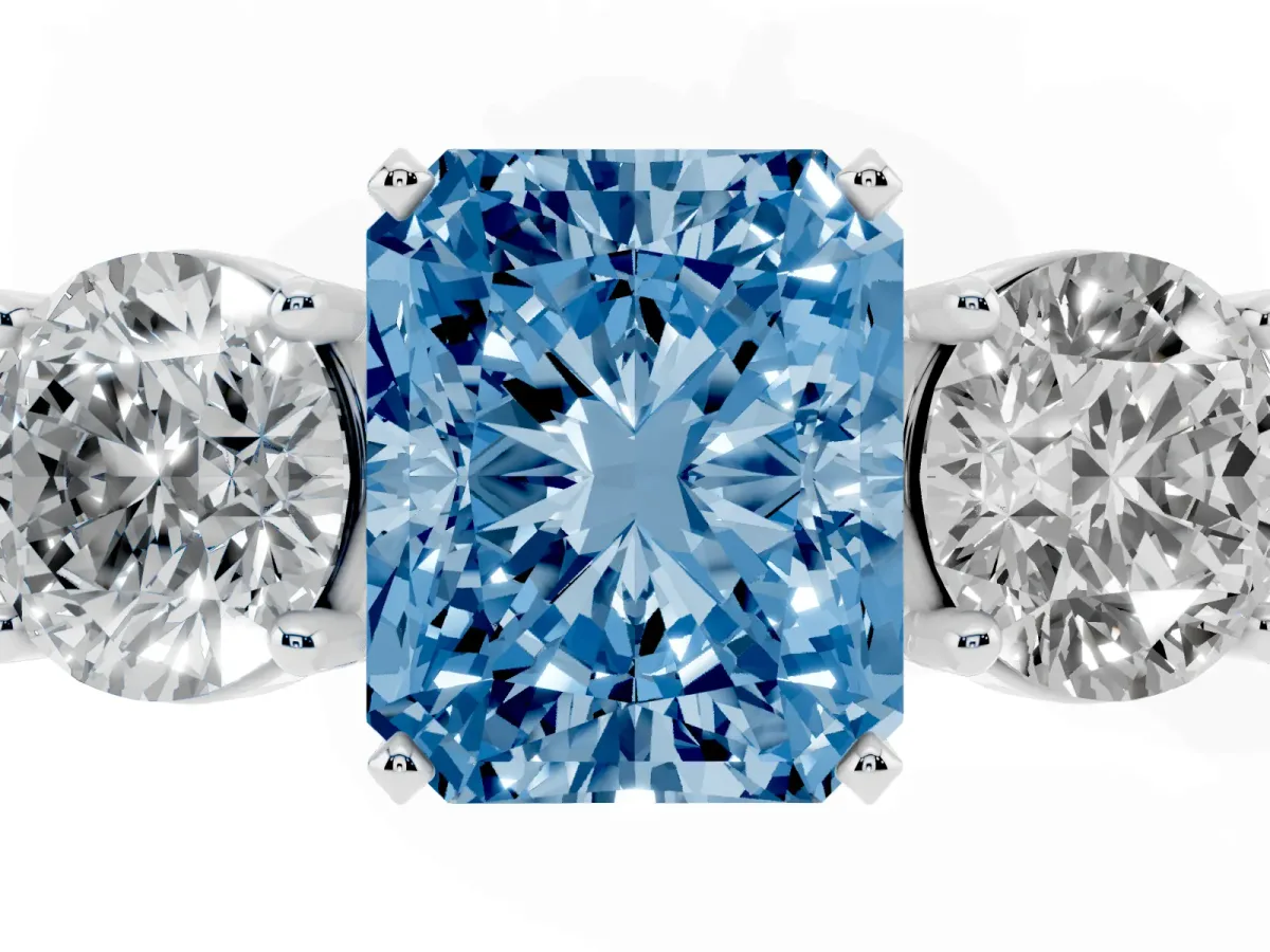 Fancy Blue Three-Stone Radiant Cut Diamond Ring with Round Side Stones, Classic Band, and Four-Prong Setting Platinum