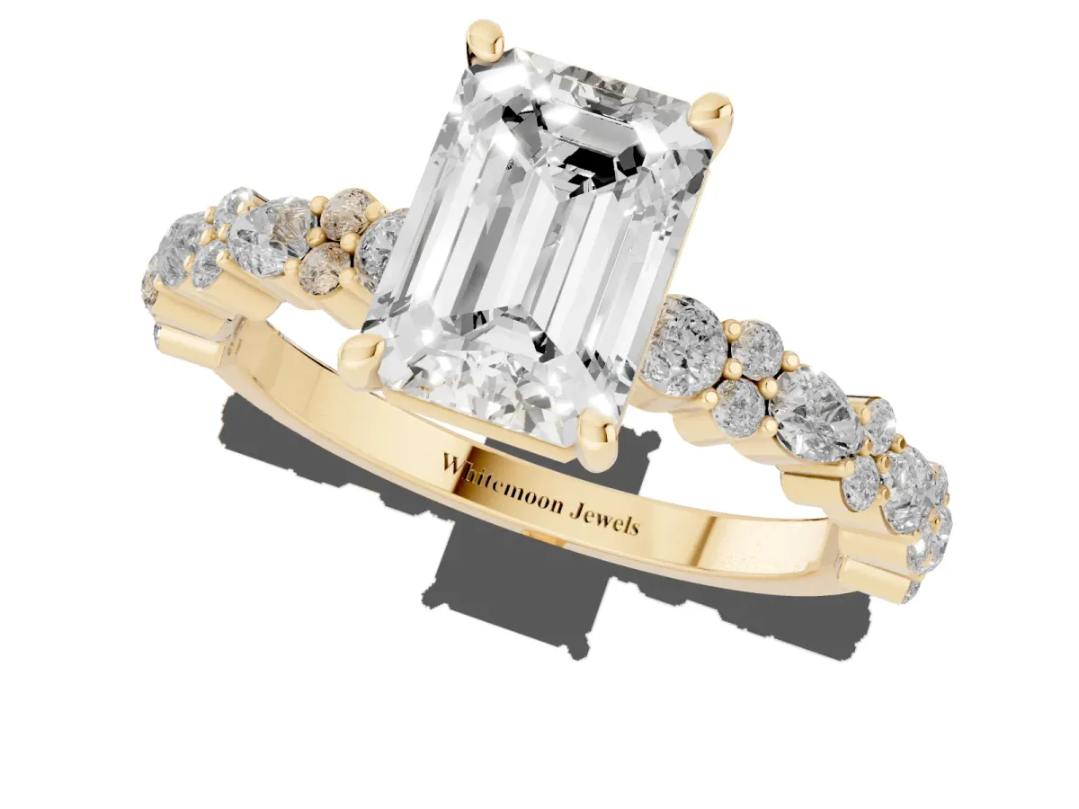 Emerald Cut Diamond Side Stone Solitaire Ring with Round and Four-Prong Setting Yellow gold