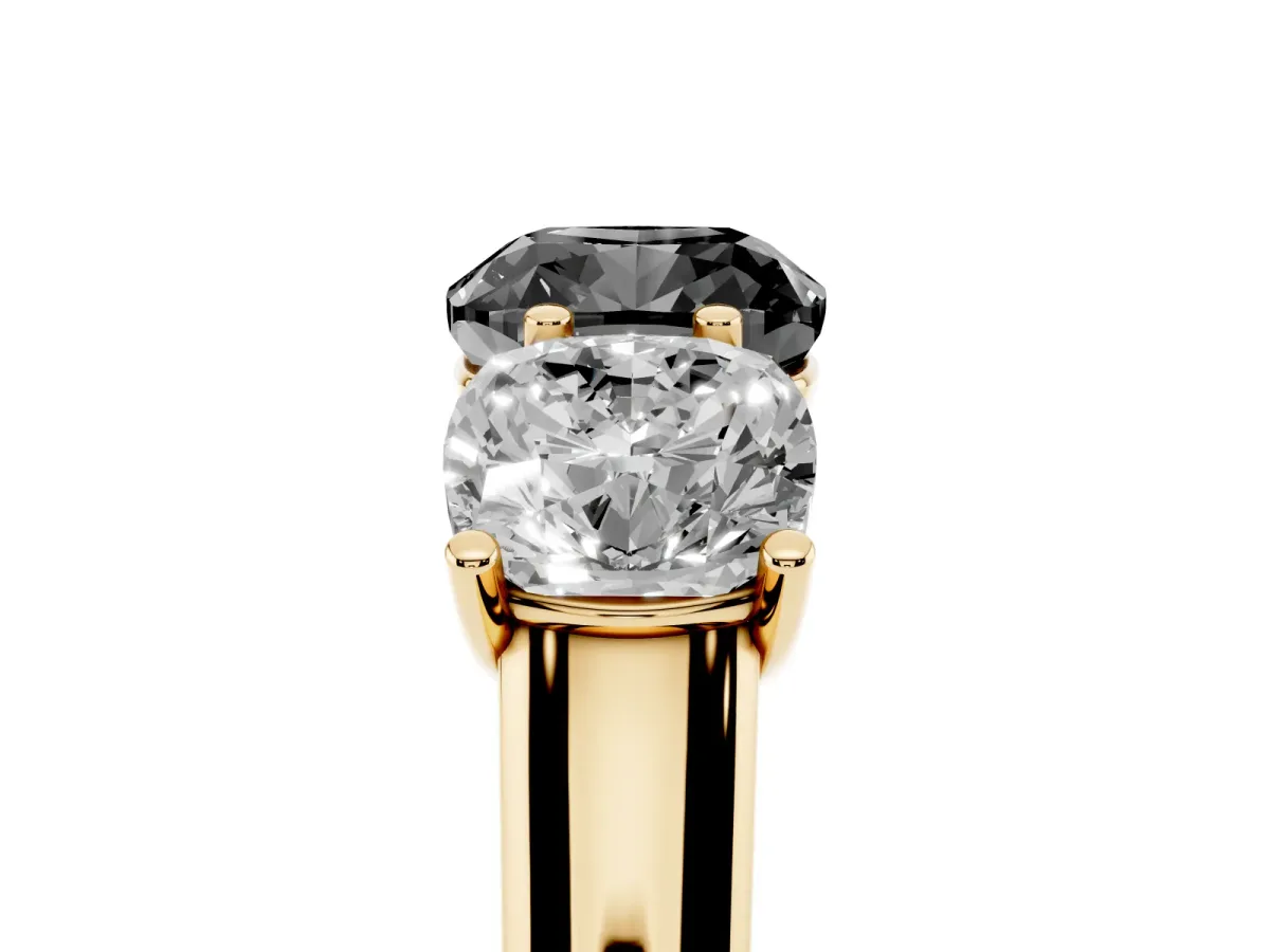 Fancy Black Cushion Cut Three-Stone Diamond Ring with Prong Setting on a Classic Band Yellow gold