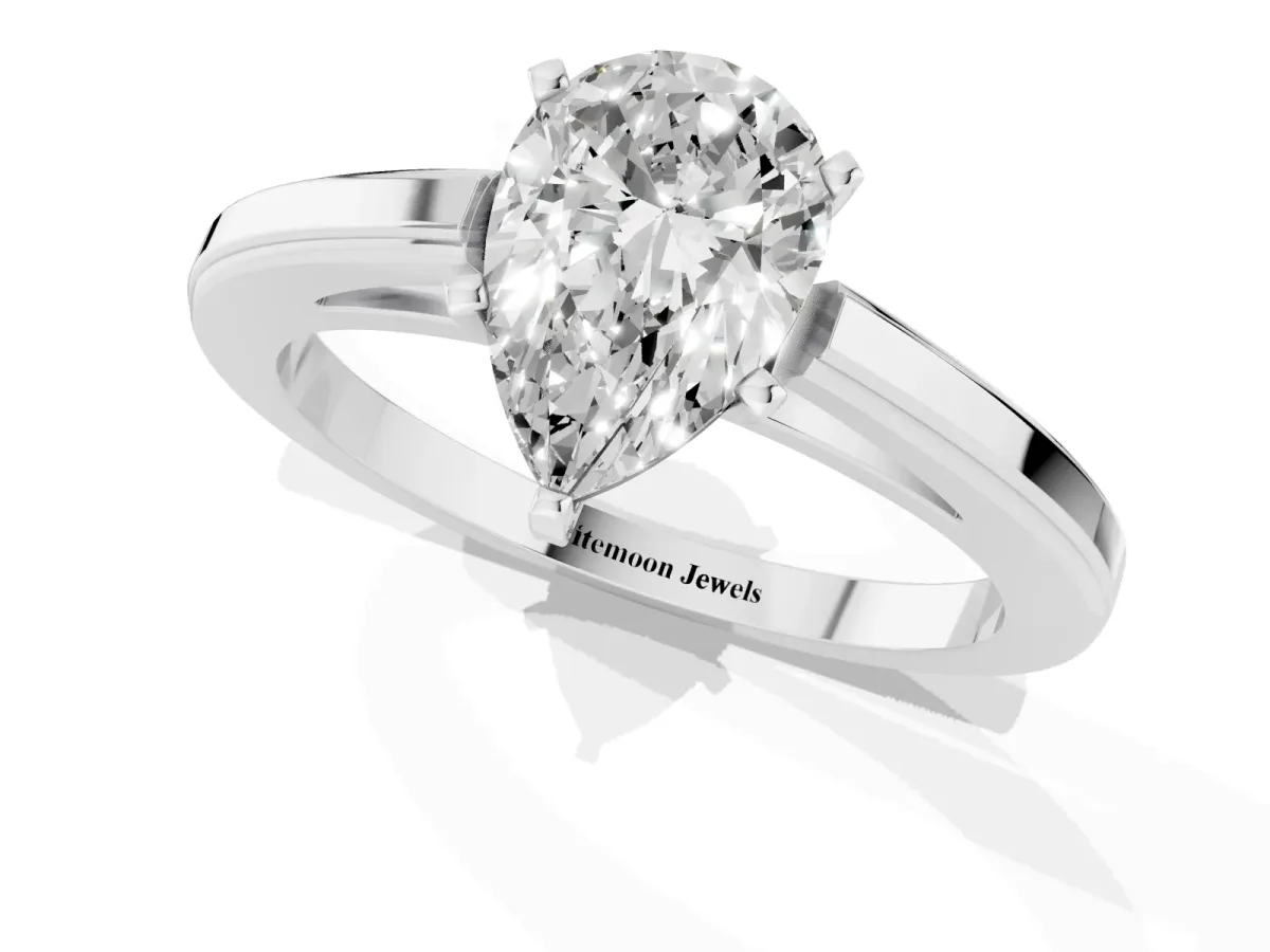 Pear Cut Solitaire Diamond Ring with Four-Prong Setting and Classic Band Platinum