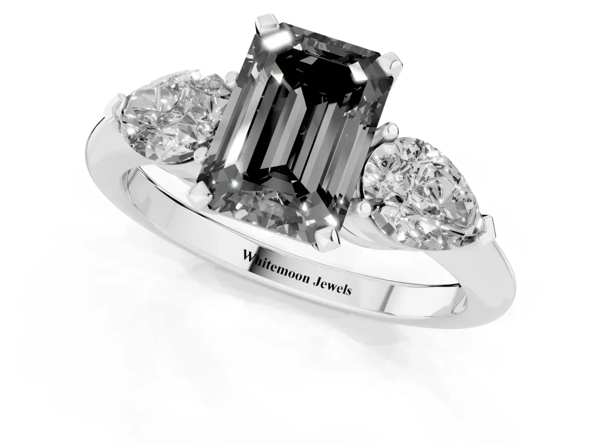 Fancy Black Three-Stone Emerald Cut Diamond Ring with Pear Side Stones and Four-Prong Setting Platinum