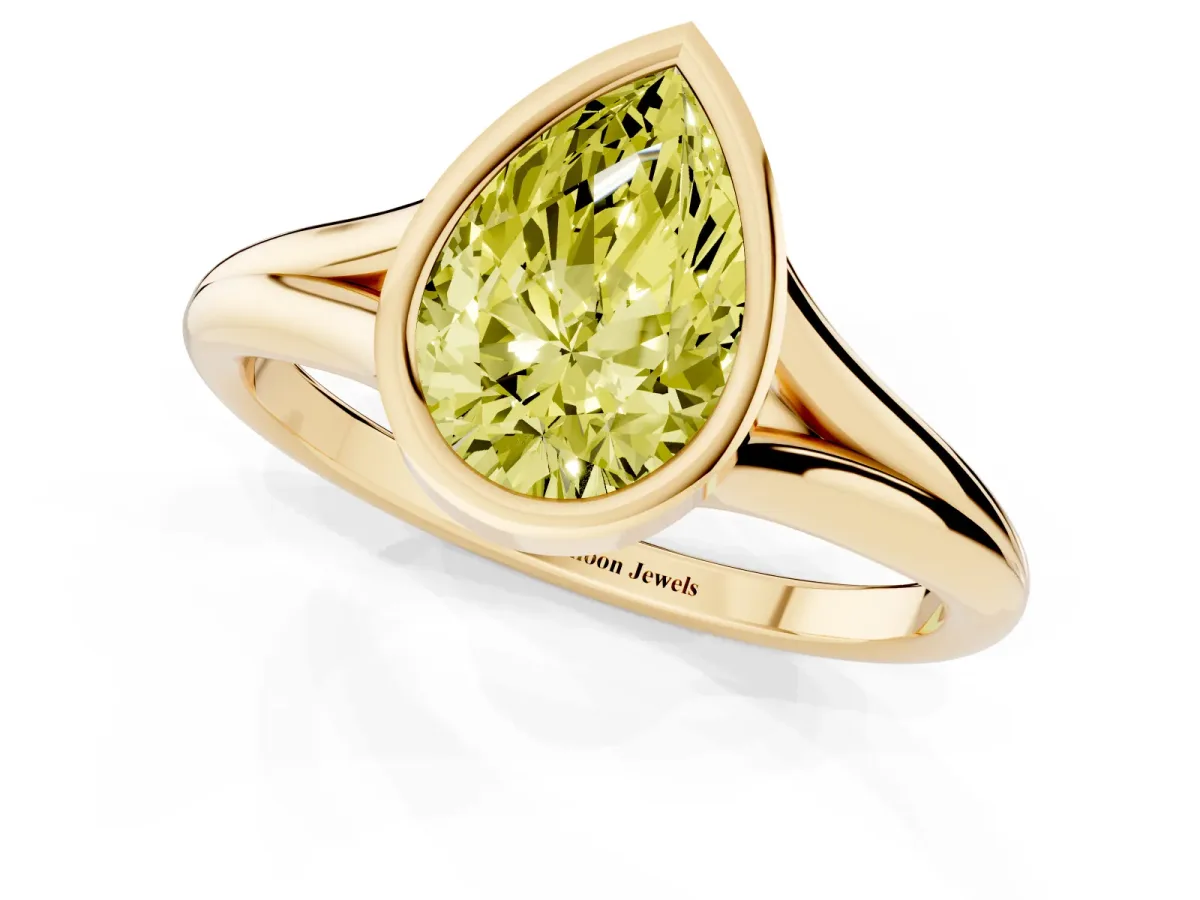 Fancy Yellow Bezel Set Pear Cut Cut Solitaire Ring with Tapered Band Yellow gold