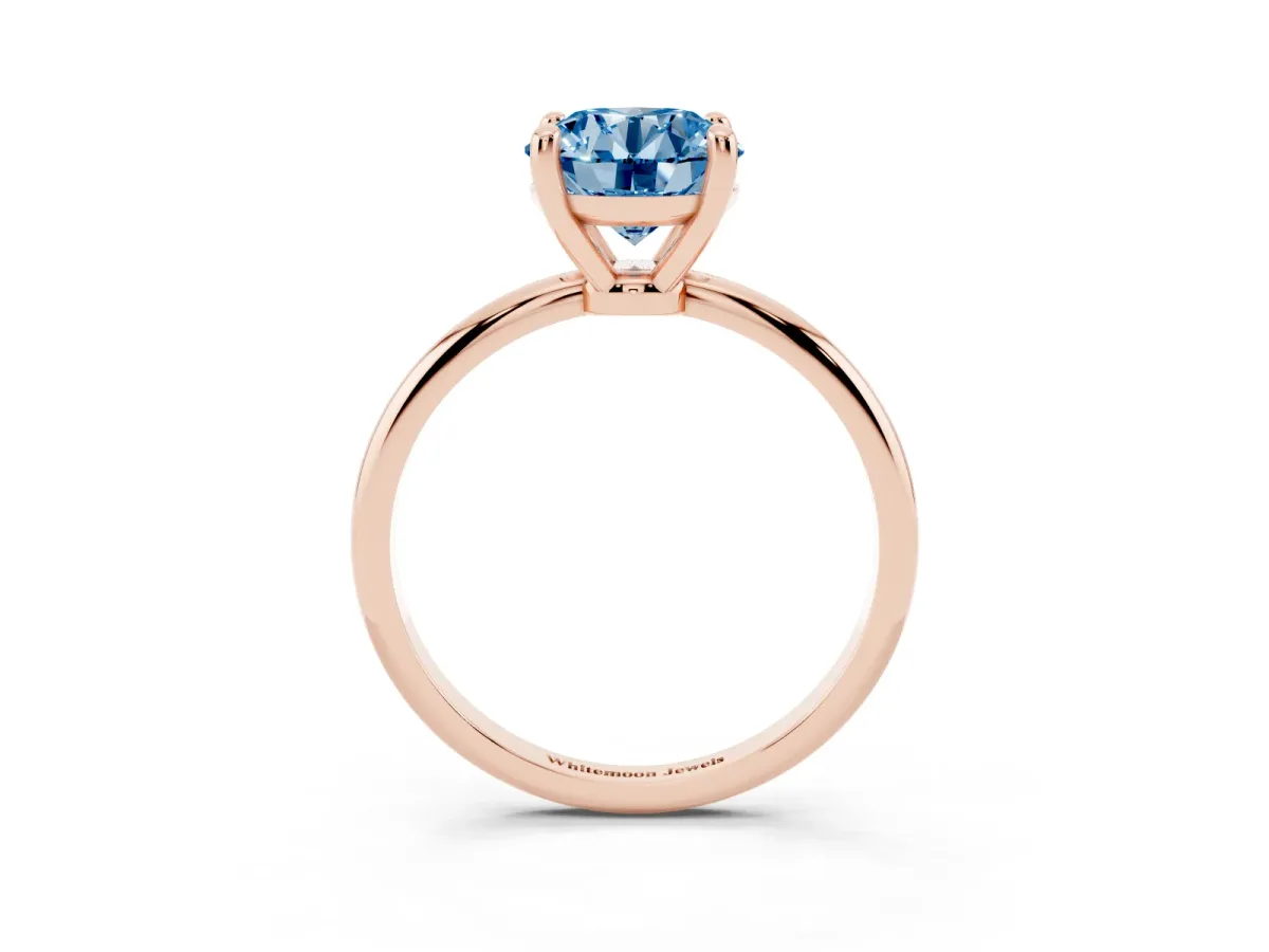 Fancy Blue Round Cut Solitaire Diamond Ring with 4-Prong Setting on a Classic Band Rose gold