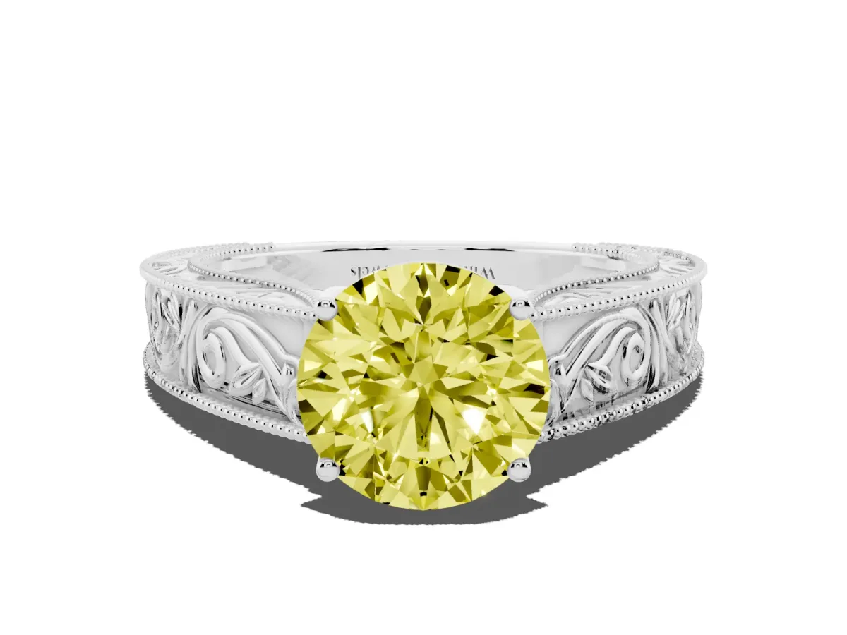 Fancy Yellow Round Cut Diamond Solitaire Ring with Engraved Band and Four-Prong Setting White gold