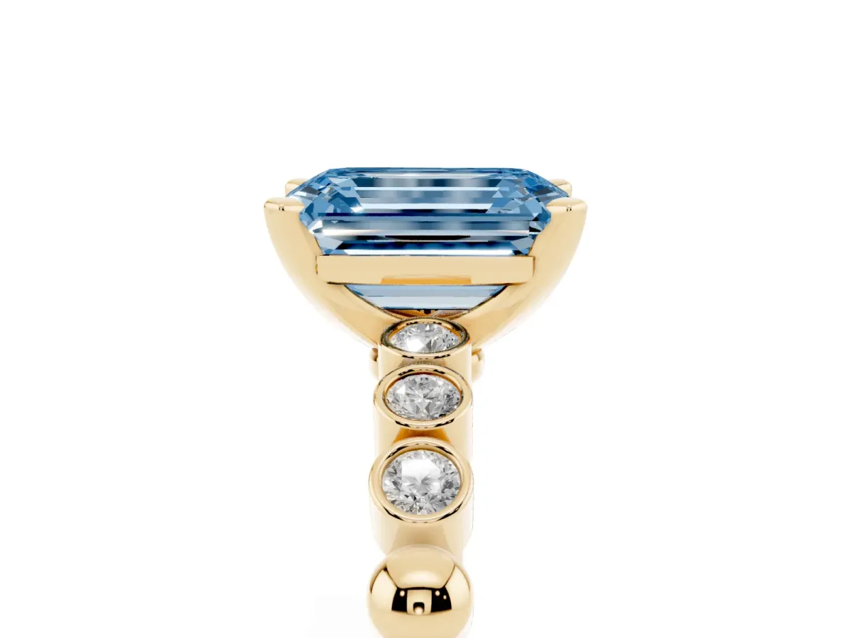 Fancy Blue Emerald Cut Solitaire Bezel Accent Diamond Engagement Ring with Beaded Band and Four-Prong Setting Yellow gold