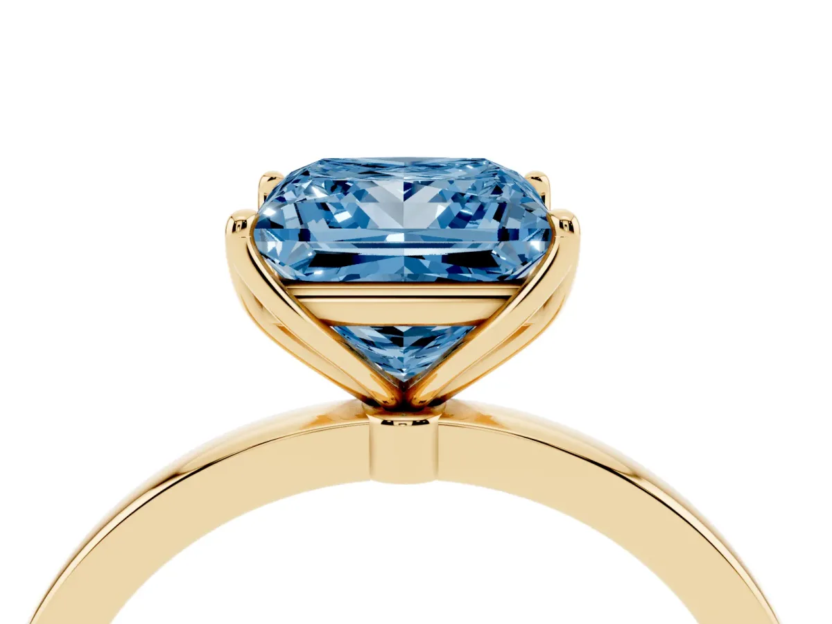 Fancy Blue Princess Cut Diamond Solitaire Ring with Thin Band and Prong Setting Yellow gold