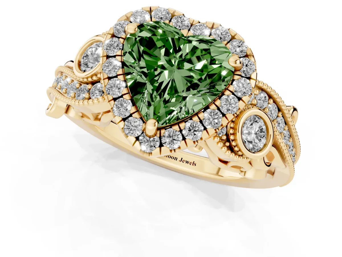 Fancy Green Heart Cut Halo Diamond Ring with Milgrain and Bezel Accents on a Split Shank Band Yellow gold