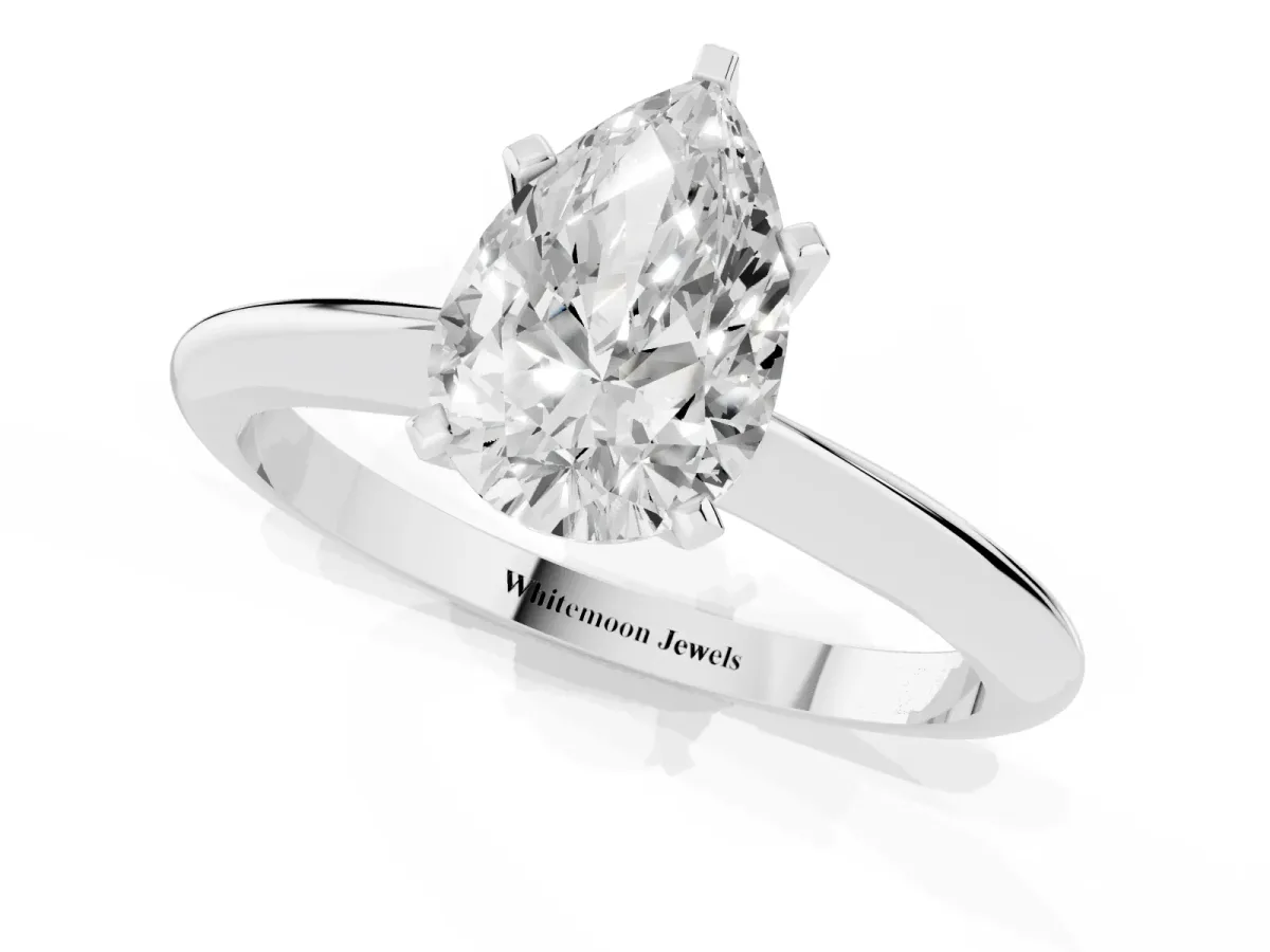 Pear Cut Cut Solitaire Ring with Four-Prong Setting on a Classic Band Silver
